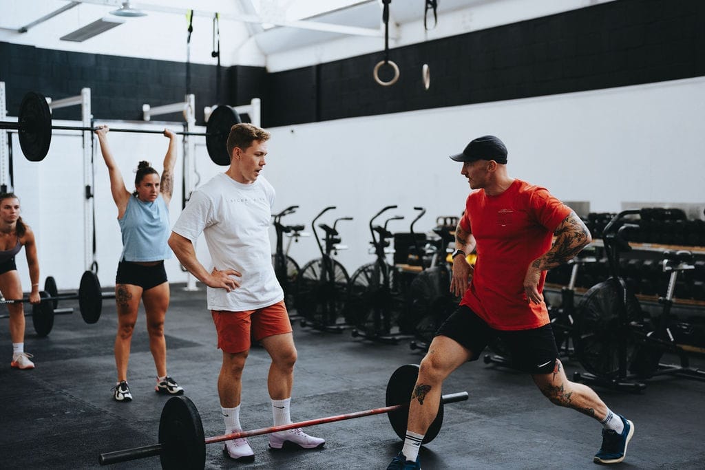 what's an emom? coach helping a member