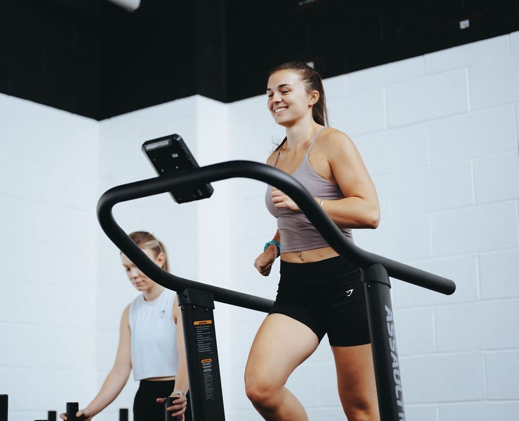 woman on assault runner in hyrox class