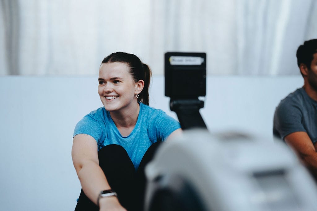 Woman rowing in SC Community CrossFit Class