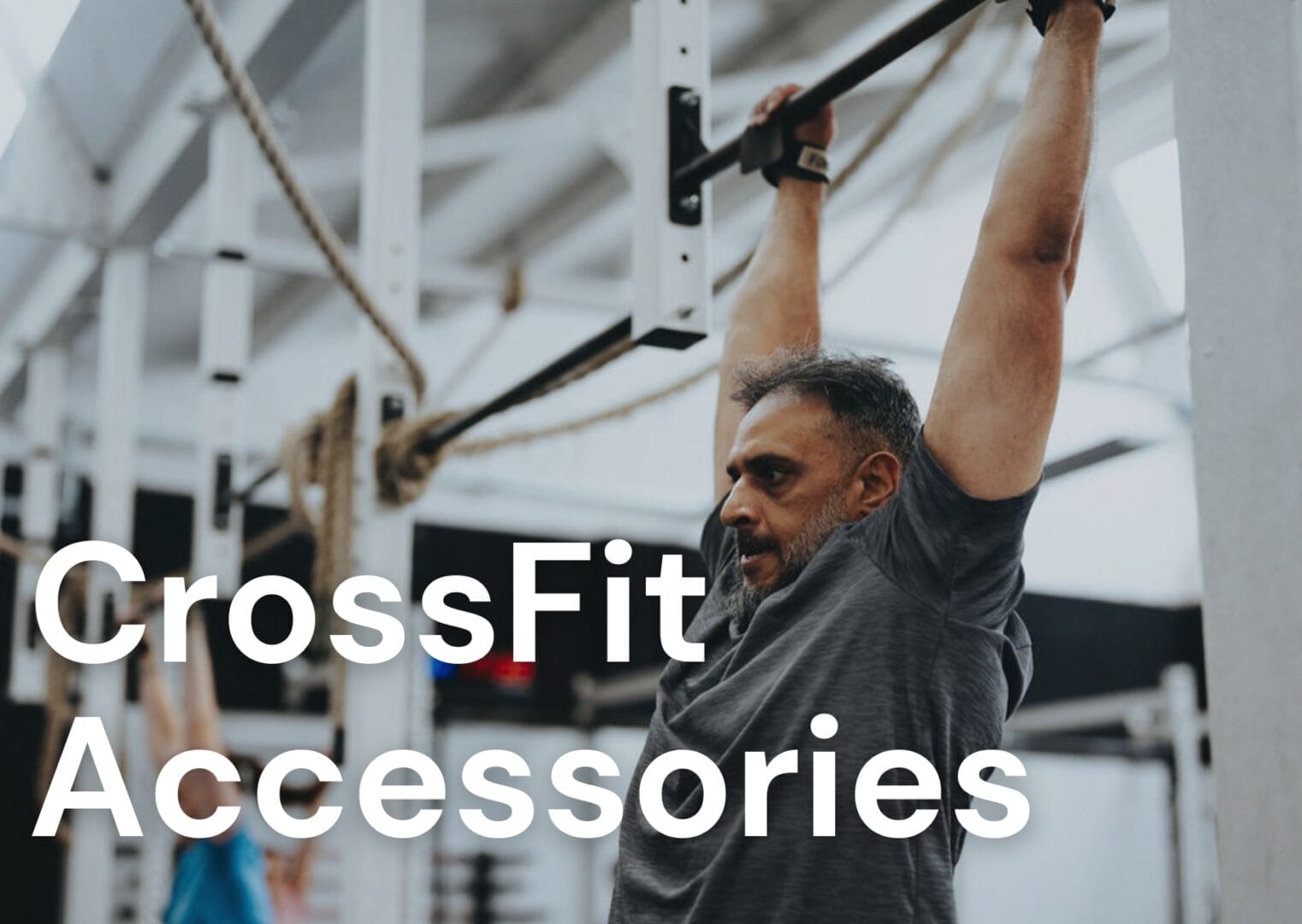Man hanging from a bar in the gym