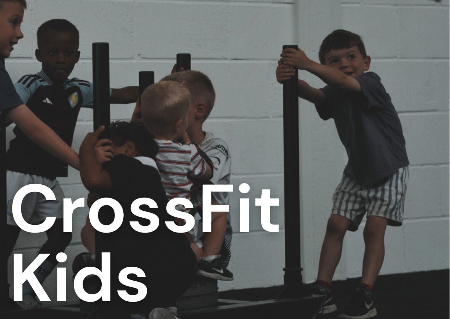 CrossFit Kids Classes at SCFIT - kids playing on sled